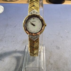 This is a vintage gold-plated women's Lassale by Seiko quartz watch with a mothe